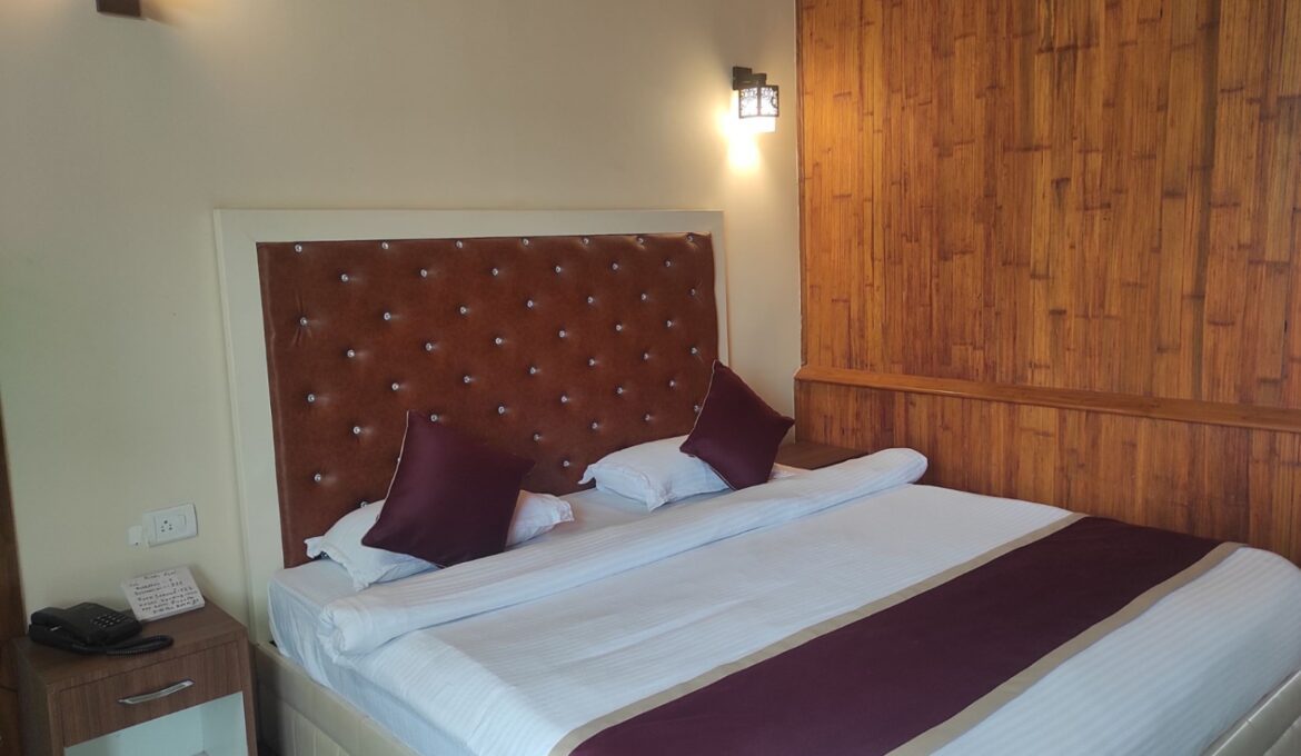 Cozy Cottage Room - Type 1 at Chang’s Resort, Guwahati with a king-sized bed, garden view, and modern amenities for a relaxing stay.