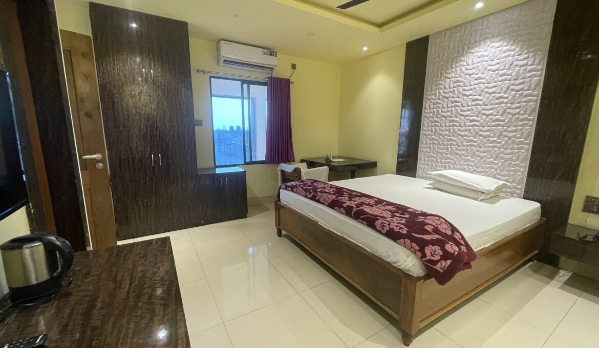 Luxurious Deluxe Room at Hotel Living Hub in North Lakhimpur, Assam, featuring modern amenities and elegant décor